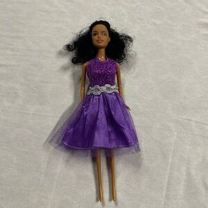 Doll With Sparkly Purple Dress